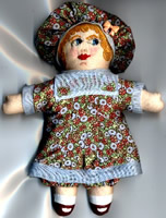 Mini cloth and embroidered doll 5 inches tall