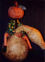 Cloth jointed doll pumpkin dude rides a gourd
