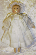 Tiny Columbian doll 9c in white dress