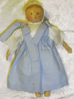 Small columbian doll 12c in blue checked dress