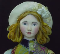 close up of embroidered cloth dolls face